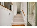 Bright home foyer featuring hardwood floors, a staircase, and natural light at 3331 Vintage Se Cir, Smyrna, GA 30080