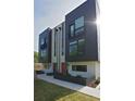 Townhouse with a striking dark and white exterior and well-maintained landscaping at 1153 Reynolds Square Ln # 16, Atlanta, GA 30307