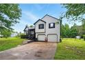 Charming two-story home boasts a well-maintained yard and a two-car garage at 18 Amanda Dr, Dallas, GA 30157
