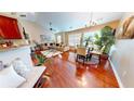 Bright living room with wood floors, plenty of natural light, modern furnishings, and decorative plants at 805 Pleasant Hill Nw Rd # 343, Lilburn, GA 30047