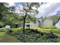 Spacious backyard featuring a wooden building and lush greenery, perfect for outdoor enjoyment at 3133 Callie Still Rd, Lawrenceville, GA 30045