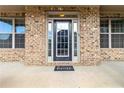 Inviting front entrance with a black door, sidelights, transom window, and 'Home' welcome mat at 3823 Dragon Fly Ln, Loganville, GA 30052