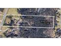 Aerial view of a 5-acre property with 3.5 acres of woods and trails, outlined in white at 2452 Camp Mitchell Rd, Grayson, GA 30017