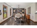 Elegant dining room features stylish decor, hardwood floors, and ample natural light at 2452 Camp Mitchell Rd, Grayson, GA 30017
