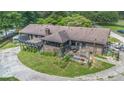 Features backyard patio with lush landscaping, fire pit and deck with greenery surrounding the home at 2452 Camp Mitchell Rd, Grayson, GA 30017