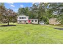 Charming two-story home with lush lawn and a detached garage in a serene, wooded setting at 3751 Cherokee Se Pl, Marietta, GA 30067