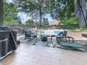 Relaxing backyard patio with comfortable seating, stone pavers, and ambient string lights at 708 Hanover Se Ln, Marietta, GA 30067