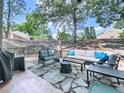 Cozy backyard patio with outdoor furniture, lush greenery, and a serene ambiance at 708 Hanover Se Ln, Marietta, GA 30067