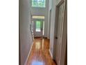 Inviting foyer with hardwood floors and a view of the glass pane front door at 421 Congress Pkwy, Lawrenceville, GA 30044
