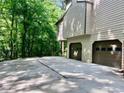 Home's two car garage featuring a large parking area at 421 Congress Pkwy, Lawrenceville, GA 30044