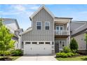 Lovely two-story home with gray siding, white trim, a spacious garage, and a welcoming front porch at 553 Onyx Lndg, Marietta, GA 30064