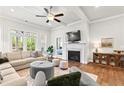 Bright living room features a fireplace, hardwood floors, stylish furniture, and abundant natural light at 553 Onyx Lndg, Marietta, GA 30064