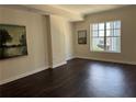 Spacious living room with hardwood floors and large windows offering lots of natural light at 1101 Juniper Ne St # 1506, Atlanta, GA 30309