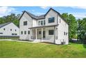 Charming new construction with a manicured lawn and covered porch at 5175 Cascade Rd, Atlanta, GA 30331
