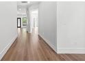 Elegant hallway featuring sleek hardwood floors and stylish wall paneling at 5175 Cascade Rd, Atlanta, GA 30331