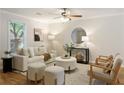 Bright living room with neutral decor, hardwood floors, and stylish furnishings at 1092 Old Roswell Rd, Roswell, GA 30076