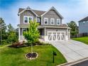Beautiful two-story home with gray siding, white trim, attached garage, and landscaped front yard at 17 Ridgeline Nw Way, Cartersville, GA 30121