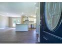 The open-concept living area and kitchen offer modern flooring and ample natural light at 550 Oglesby Bridge Se Rd, Conyers, GA 30094