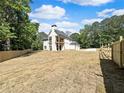 Expansive backyard featuring a home with a deck and a well-maintained fence surrounding the property at 1461 Leach Dr, Lawrenceville, GA 30045