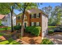 Two-story home with brick and siding exterior and well-maintained landscaping at 2151 Hamstead Ct, Suwanee, GA 30024