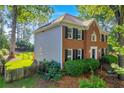 Two-story home with brick and siding exterior and fenced backyard at 2151 Hamstead Ct, Suwanee, GA 30024