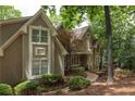 Charming exterior with manicured landscaping, stone accents, and well-placed windows offering ample natural light at 3800 Schooner Rdg, Alpharetta, GA 30005