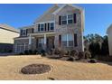 Charming two-story home with brick and siding accents, complemented by a green lawn at 522 Spring View Dr, Woodstock, GA 30188