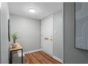 Inviting entryway with wood floors, a white front door, and modern decor creating a warm welcome at 3663 Essex Ave # 29, Atlanta, GA 30339
