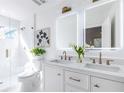Elegant bathroom features double vanity, glass-enclosed shower, and modern fixtures providing a spa-like experience at 75 Mayson Ne Ave, Atlanta, GA 30307