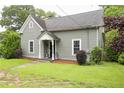 Beautiful one-story home featuring a well-kept lawn and lovely front porch at 1096 Tilden Nw St, Atlanta, GA 30318