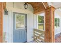 Close-up of a stylish front door with decorative glass and wood accents at 3275 Dodson Dr, East Point, GA 30344