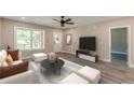 Bright living room with a ceiling fan and large window at 3275 Dodson Dr, East Point, GA 30344