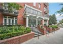 Elegant brick building exterior with manicured landscaping and wrought iron balconies, offering timeless appeal at 206 Ne 11Th Ne St # 703A, Atlanta, GA 30309