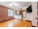 Inviting living room with exposed brick wall and updated lighting fixture at 36 Daniel Se St # 5, Atlanta, GA 30312