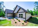 Beautiful one-story home with gray siding, stone accents, and a well-maintained lawn at 8088 Lakeview Pkwy, Villa Rica, GA 30180