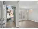 Bright entryway featuring hardwood floors, white trim, a view of the front yard, and plenty of natural light at 2058 Drogheda Ln, Marietta, GA 30066