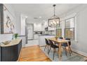 Bright kitchen with white cabinets, stainless steel appliances, and a modern dining area at 571 Morgan Ne St, Atlanta, GA 30308