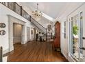 Grand foyer with soaring ceilings, elegant staircase, hardwood floors, and abundant natural light at 1466 University Dr, Atlanta, GA 30306
