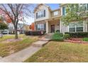 Beautiful home with landscaped front yard, stone accents, and a welcoming entrance at 2450 Mildon Hall Ln, Lawrenceville, GA 30043