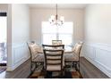 A well-lit dining area featuring a stylish table with seating for four at 103 Prominence Ct, Canton, GA 30114