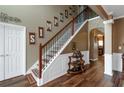 Inviting foyer featuring a staircase with wooden banister and decorative wall accents at 1104 Stepping Stone Ln, Conyers, GA 30012