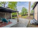 Relaxing backyard patio area with outdoor furniture and a peaceful garden view at 2382 Whites Mill Ln, Decatur, GA 30032