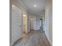 Hallway with wood-look flooring and doors leading to various rooms at 109 Sunflower Ne Cir, Cartersville, GA 30121