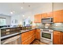 Well-equipped kitchen with granite countertops, stainless steel appliances, and seamless flow to the living area at 1418 Dresden Ne Dr # 385, Brookhaven, GA 30319