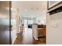 Open-concept living space with hardwood floors, a cozy seating area, and natural light streaming through large windows at 1418 Dresden Ne Dr # 385, Brookhaven, GA 30319