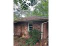 Backyard showing the brick wall of the home's exterior at 2226 Medfield Ne Trl, Atlanta, GA 30345