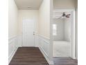 Inviting entryway with wood floors, white walls, and views to the living room and provides a warm welcome at 131 Prominence Ct, Canton, GA 30114