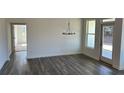 Bright dining room with hardwood floors, chandelier, and ample natural light at 204 Saratoga Dr, Acworth, GA 30102