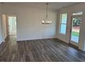 Open dining room featuring modern lighting and natural light at 204 Saratoga Dr, Acworth, GA 30102