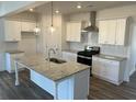 Modern kitchen with stainless steel appliances, granite countertops, and large island at 204 Saratoga Dr, Acworth, GA 30102
